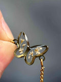 Bracelet ajustable doré avec petites fleurs sechées - forme de papillon